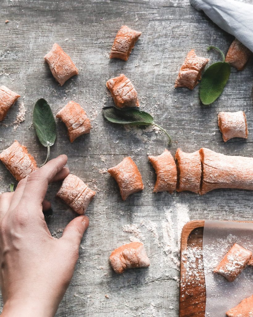 Healthy sweet potato gnocchi in the making with sage leaves