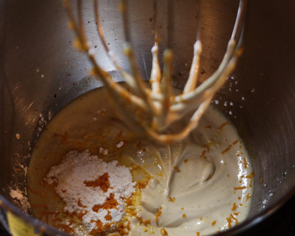 Adding baking powder and vanilla pudding powder to the egg yolk and yoghurt mass