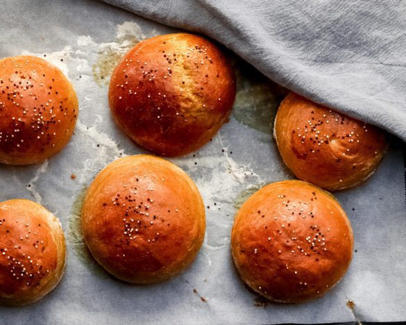 baked burger buns on a baking sheet