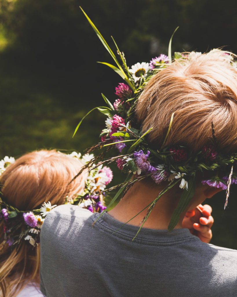 two kids with flower crowns