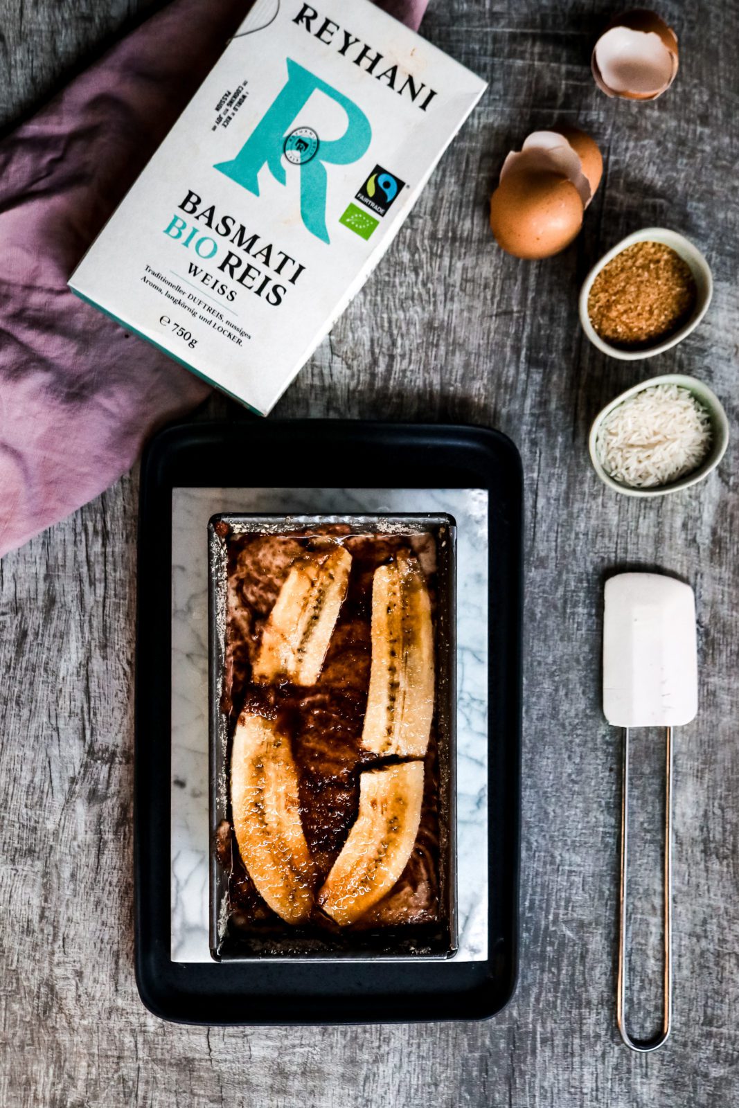 unbaked basmati rice banana bread on a marbled plate