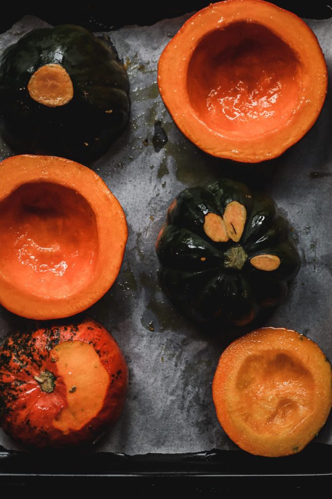 baked pumpkin halves on a baking sheet , pumpkin recipes , risotto recipes, holiday recipes