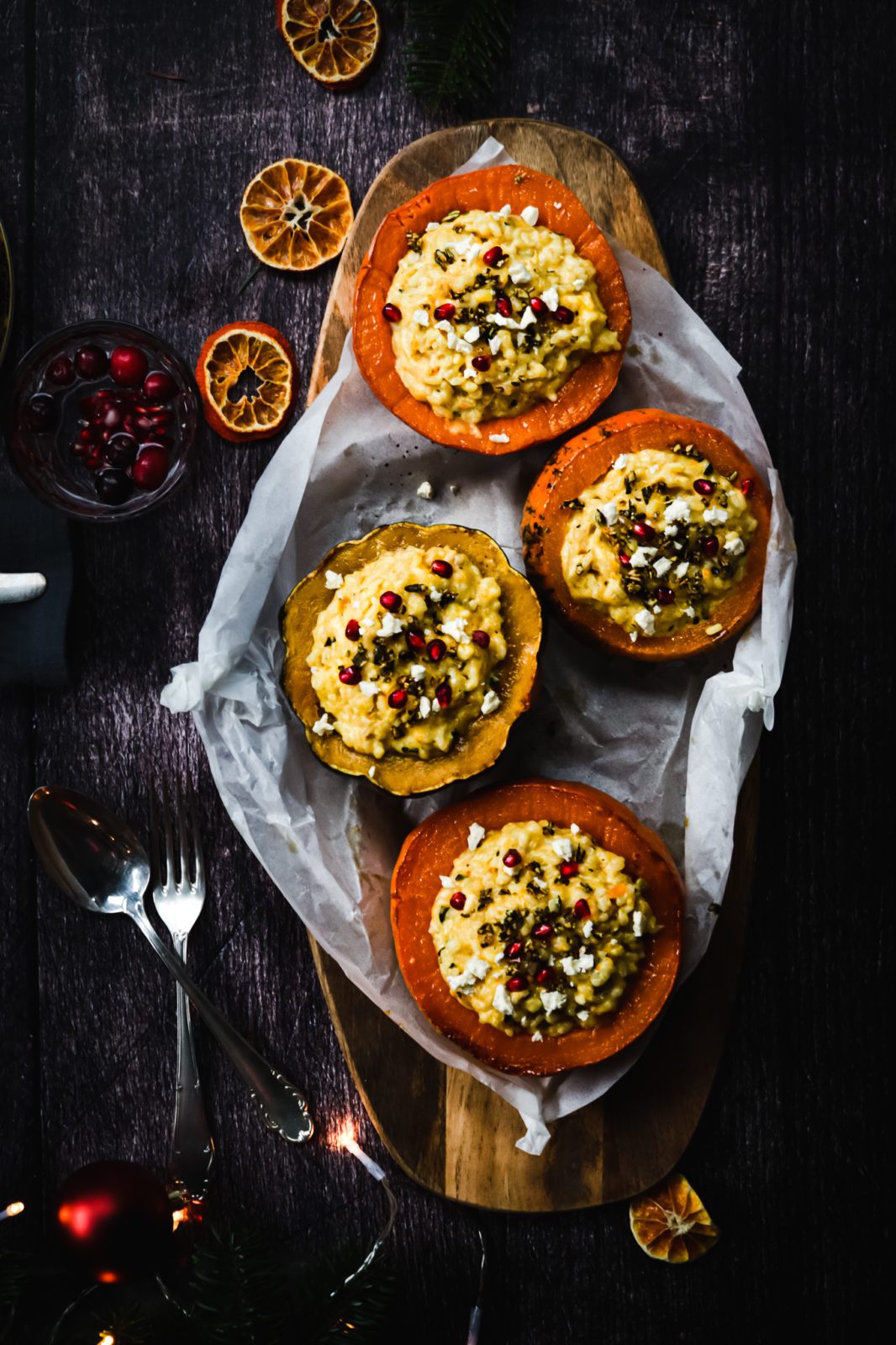 Festive vegetarian pumpkin risotto with pomegranate seeds and feta crumbs