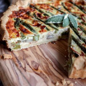 Quiche filled with asparagus, mushrooms, mozzarella and parmesan cheese