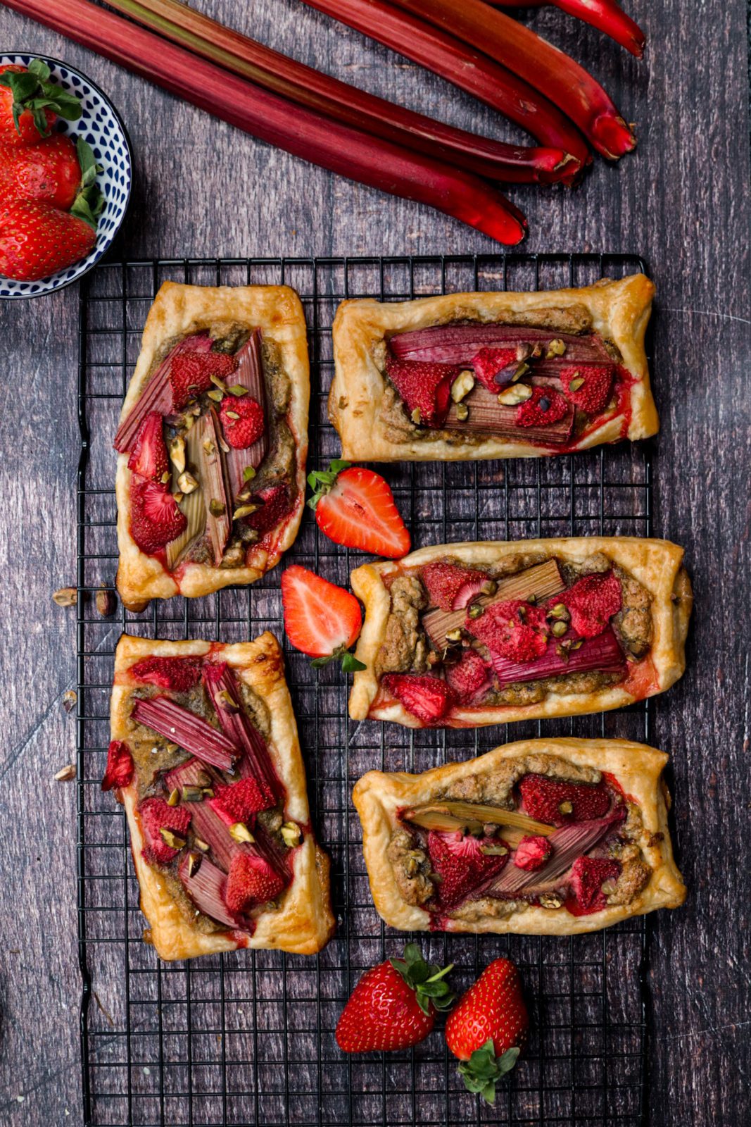 Strawberry-Rhubarb Pastry Tarts filled with almond frangipane