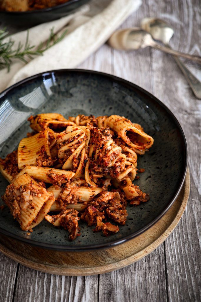 vegetarian cauliflower bolognese served on blue marbled stone plates