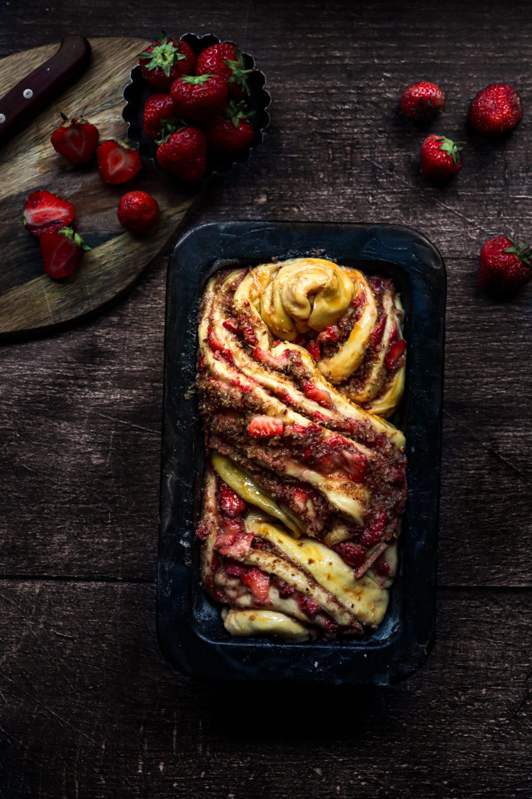 Saffron brioche babka filled with fresh strawberries and coconut and cardamom