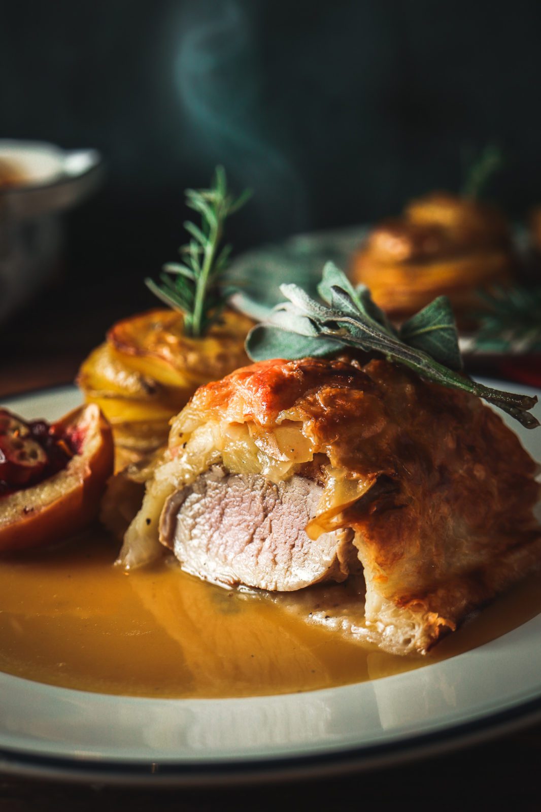 Pork tenderloin in puff pastry with caramelized apples, onions and fresh sage – a fancy dinner recipe